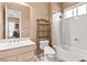 Bathroom featuring a shower-tub combination, a vanity with a sink and decorative shelving at 10234 Renae Nicole Ct, Las Vegas, NV 89183