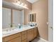 Bathroom featuring double sinks, ample counter space, and neutral tones at 10234 Renae Nicole Ct, Las Vegas, NV 89183