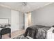 Bright bedroom featuring a ceiling fan, desk area, and neutral tones at 10234 Renae Nicole Ct, Las Vegas, NV 89183