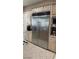 A stainless steel refrigerator stands out in this kitchen with granite countertops at 10234 Renae Nicole Ct, Las Vegas, NV 89183