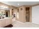 Spacious bathroom featuring tile flooring, glass-enclosed shower, and ample natural light at 10234 Renae Nicole Ct, Las Vegas, NV 89183