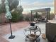 Outdoor patio area with a built in grill, seating, and umbrella at 11177 Deluna St, Las Vegas, NV 89141