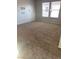 Bedroom featuring neutral carpeting and large windows providing plenty of natural light at 11177 Deluna St, Las Vegas, NV 89141