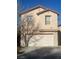 Charming two-story home featuring attached garage and desert landscaping at 11177 Deluna St, Las Vegas, NV 89141