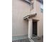 Front door with a screen and tile overhang on a tan stucco home at 11177 Deluna St, Las Vegas, NV 89141