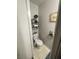 Half bath featuring a toilet, wall art, and a decorative shelf at 11177 Deluna St, Las Vegas, NV 89141