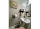 Half bath featuring a pedestal sink, a mirror, and wall art at 11177 Deluna St, Las Vegas, NV 89141