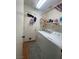 Convenient laundry room with washer, dryer and storage shelves at 11177 Deluna St, Las Vegas, NV 89141