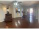 Open-concept living room with wood floors, neutral paint, and lots of natural light at 11177 Deluna St, Las Vegas, NV 89141