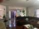 Living room with hardwood floors, with views into the kitchen and dining room at 11177 Deluna St, Las Vegas, NV 89141