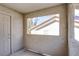 Private balcony featuring textured walls and a view of a neighboring building through a cut-out window at 4200 S Valley View Blvd # 3030, Las Vegas, NV 89103