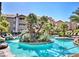 Resort-style community pool with lush tropical landscaping and a relaxing rock waterfall feature at 4200 S Valley View Blvd # 3030, Las Vegas, NV 89103