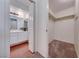 Hallway view of the bathroom featuring a double vanity, and linen closet at 5255 Dickens Dr # 0, Las Vegas, NV 89119