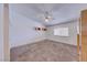 Bright bedroom featuring a ceiling fan, neutral carpet, and closet at 5255 Dickens Dr # 0, Las Vegas, NV 89119