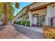 Charming townhome showcasing a tidy walkway and mature landscaping at 5255 Dickens Dr # 0, Las Vegas, NV 89119