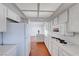 Well-equipped kitchen with ample counter space and white cabinetry, seamlessly connecting to the living area at 5255 Dickens Dr # 0, Las Vegas, NV 89119