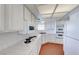 Well-lit kitchen featuring white cabinets, modern appliances, and ample counter space for cooking at 5255 Dickens Dr # 0, Las Vegas, NV 89119