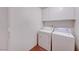 Convenient laundry room with a washer, dryer, and storage cabinets at 5255 Dickens Dr # 0, Las Vegas, NV 89119