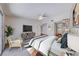 Spacious main bedroom featuring a ceiling fan, large TV, and bright natural light at 5255 Dickens Dr # 0, Las Vegas, NV 89119