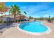 Sparkling community pool surrounded by lush landscaping and comfortable seating at 5255 Dickens Dr # 0, Las Vegas, NV 89119