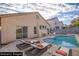 Backyard with a pool and lounge chairs ready for relaxation at 7936 Pinnochio Ave, Las Vegas, NV 89131