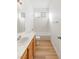 Bright bathroom featuring a shower-tub combo and a light wood vanity at 7936 Pinnochio Ave, Las Vegas, NV 89131