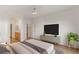 Spacious bedroom featuring an ensuite bathroom, large window and modern lighting at 7936 Pinnochio Ave, Las Vegas, NV 89131