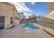 Backyard view of the small in-ground pool and concrete patio at 7936 Pinnochio Ave, Las Vegas, NV 89131