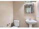 Clean and well-lit bathroom with pedestal sink at 9790 Overlook Ridge Ave, Las Vegas, NV 89148