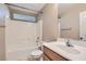 Clean bathroom with shower/tub combo and wood vanity at 9790 Overlook Ridge Ave, Las Vegas, NV 89148