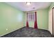 Light green bedroom with double closet and window at 9790 Overlook Ridge Ave, Las Vegas, NV 89148