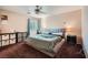 Bedroom with ceiling fan, carpet, and window coverings at 9790 Overlook Ridge Ave, Las Vegas, NV 89148