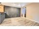 Bright dining area with wood-look tile floors and modern light fixtures at 9790 Overlook Ridge Ave, Las Vegas, NV 89148