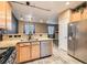 Kitchen with stainless steel appliances and granite countertops at 9790 Overlook Ridge Ave, Las Vegas, NV 89148