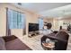 Relaxing living room with TV and comfy seating at 9790 Overlook Ridge Ave, Las Vegas, NV 89148