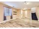 Light and airy living room with wood-look floors at 9790 Overlook Ridge Ave, Las Vegas, NV 89148