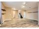 Open living area with wood-look floors, and a staircase at 9790 Overlook Ridge Ave, Las Vegas, NV 89148