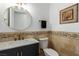 Stylish bathroom with dark vanity, updated fixtures, and tile at 2108 Grand Island Ct, Las Vegas, NV 89117