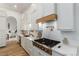 Modern kitchen with white cabinets, stainless steel appliances, and a hexagon backsplash at 2108 Grand Island Ct, Las Vegas, NV 89117