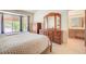 This bedroom is brightly lit with a large bed, and a view into the Primary bathroom at 3013 Sungold Dr, Las Vegas, NV 89134