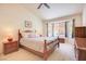 Bright bedroom with a cozy bed, bedside tables, and a large window at 3013 Sungold Dr, Las Vegas, NV 89134