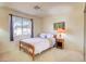 Bedroom with a bright sunny window and a lamp at 3013 Sungold Dr, Las Vegas, NV 89134