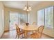 Cozy dining area featuring a round wooden table with seating for four at 3013 Sungold Dr, Las Vegas, NV 89134