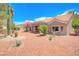Attractive desert home features low-maintenance landscaping, tiled roof, and covered patio at 3013 Sungold Dr, Las Vegas, NV 89134