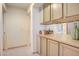 Hallway with built-in cabinets and a view of adjoining rooms at 3013 Sungold Dr, Las Vegas, NV 89134