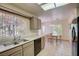 Bright kitchen with stainless steel appliances and a view to the cozy dining area at 3013 Sungold Dr, Las Vegas, NV 89134