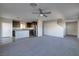 Open living room with grey carpet, kitchen island and stairs at 3506 Judson Ave, Las Vegas, NV 89115