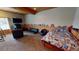 Finished basement includes a bedroom, sitting area, and plenty of space for recreation at 3490 S Adobe Ct, Pahrump, NV 89048