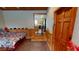 Multi-purpose basement room features a bed, sitting area, and access to other areas at 3490 S Adobe Ct, Pahrump, NV 89048