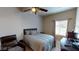 Comfortable bedroom complete with a queen-size bed, ceiling fan, and ample natural light at 3490 S Adobe Ct, Pahrump, NV 89048